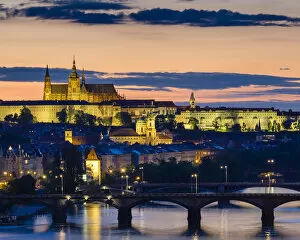 Czech Republic, Prague. Prague Castle, Pazsky Hrad, and the Vltava River at sunset