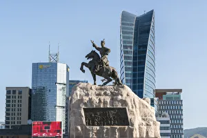 Damdin Sukhbaatar statue with skyscrapers in the background. Ulan Bator, Mongolia