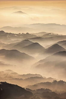 Images Dated 26th June 2023: Dawn over the foothills of the Kamnik Savinja Alps from Kravavec, Slovenia