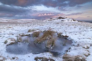 Moorland Prints: Dawn sky over frozen pool on moorland near East Mill Tor, Dartmoor, Devon, England