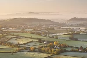 Dawn view over misty Somerset Levels countryside towards Glastonbury Tor, Somerset, England