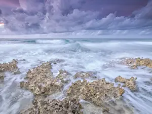 Rainy Season Prints: Daybreak on the Caribbean Sea along the rugged ironshore of Grand Cayman in the Cayman Islands