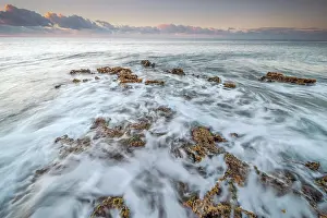 Ironshore Prints: Daybreak on the Caribbean Sea along the rugged ironshore of Grand Cayman in the Cayman Islands