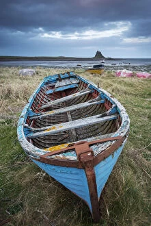 Decaying, rusty old boat on the shore of the Holy Island of Lindisfarne, Northumberland