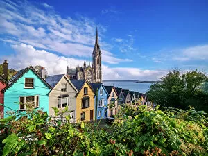 Images Dated 31st March 2023: Deck of Cards colourful houses and St. Colman's Cathedral, elevated view, Cobh, County Cork, Ireland