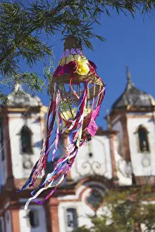 Decoration for festival with Our Lady of Conceicao de Antonio Dias Church in background