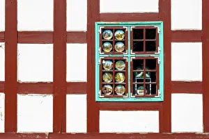 Fachwerk Prints: Decorative Plates in a Window in a Fachwerk Styled Traditional Building