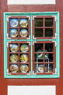 Fachwerk Prints: Decorative Plates in a Window in a Fachwerk Styled Traditional Building