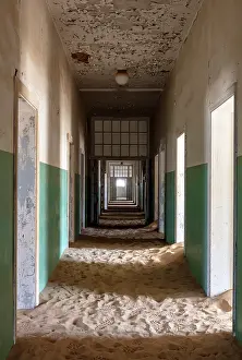 Luderitz Prints: Derelict hospital with floor covered in sand in abandoned diamond mining town of Kolmanskop