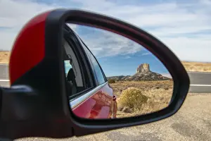 Reservation Prints: Desert landscape with lonely butte hill reflected into a car side mirror, Navajo Nation