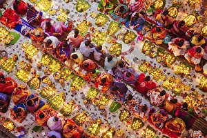 Devotees attend prayer with burning incense and light oil lamps before break fasting