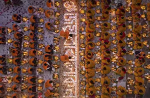 Devotees attend prayer with burning incense and light oil lamps before break fasting