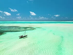 Crystal Collection: Dhow boat in the turquoise lagoon during low tide, Paje, Jambiani, Zanzibar, Tanzania