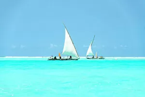 East Africa Gallery: Dhow boats sailing in the crystal turquoise water of the Indian Ocean, Paje, Jambiani, Zanzibar