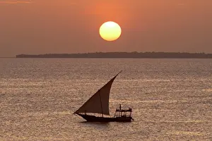 Dhow in silhouette at sunset, Nungwi, Zanzibar, Tanzania