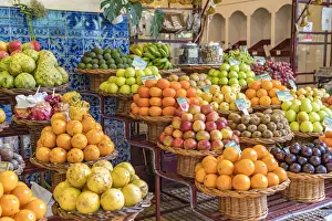 Different varieties of passion fruit and local fruit at Mercado dos Lavradores