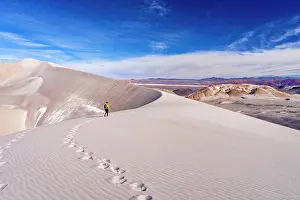 Walk Prints: Distant man on white dunes, Campo de Piedra Pomez