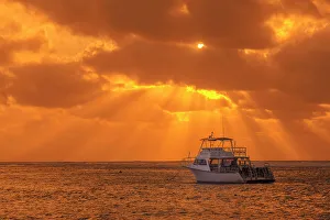 Tropical Destination Prints: Dive boat at sunrise on the Caribbean Sea on Cayman Brac