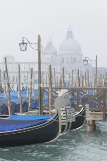 Docked gondolas along the Riva degli Schiavoni, near Piazza San Marco