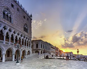 Marco Prints: Doges Palace in Venice, Riva degli schiavoni, during the sunrise, with tourists