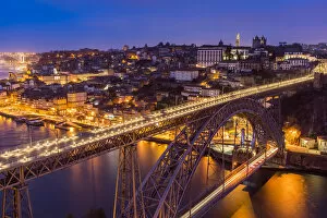 Dom Luis I bridge and city skyline at dusk, Porto, Portugal