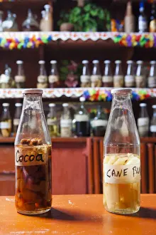 Bottles Prints: Dominica, Castle Bruce. A selection of local rums at Islet View Restaurant and Bar