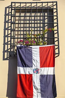 Dominican Republic, Santa Domingo, Colonial zone, Dominican flag hanging from window