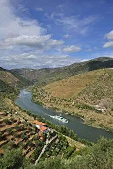 Images Dated 26th November 2013: The Douro river and a hotel-ship in the Valeira Dam. Sao Joao da Pesqueira, Portugal