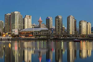 Downtown skyline reflected into the False Creek at sunrise, Vancouver, British Columbia