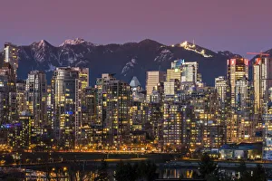 Blue Hour Prints: Downtown skyline with snowy mountains behind at dusk, Vancouver, British Columbia, Canada
