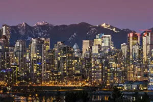 Images Dated 2nd February 2016: Downtown skyline with snowy mountains behind at dusk, Vancouver, British Columbia, Canada