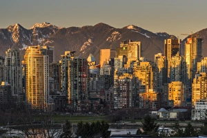 Vancouver Prints: Downtown skyline with snowy mountains behind at sunset, Vancouver, British Columbia