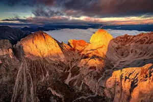 Environment Prints: Dramatic cloudy sky and mist of autumn at dawn over Catinaccio (Rosengarten) and Roda De Vael