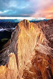 Orange Color Prints: Dramatic sky at dawn over Catinaccio (Rosengarten) and Cima Catinaccio mountains in autumn