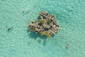 Scenics Collection: a drone shot to capture some people snorkeling around Crystal Rock, Le Morne Brabant