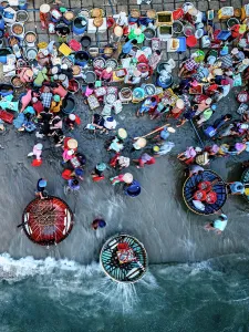 Straight Down Prints: Drone view of the crowded coastal fish market in Tam Tien