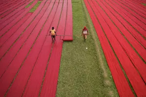Worker Gallery: Drying red fabrics under sunlight, Narsingdi, Bangladesh