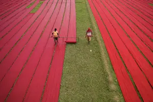 Fabrics Prints: Drying red fabrics under sunlight, Narsingdi, Bangladesh