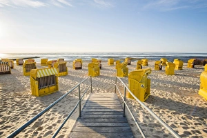 Nordsee Prints: Duhnen, Cuxhaven, Lower Saxony, Germany. Yellow Strandkorbs along the beach