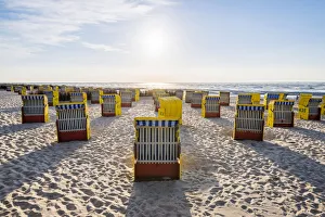 Duhnen, Cuxhaven, Lower Saxony, Germany. Yellow Strandkorbs along the beach