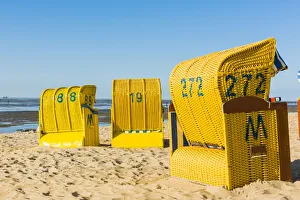 Duhnen, Cuxhaven, Lower Saxony, Germany. Yellow Strandkorbs along the Wadden Sea