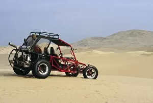 Adventurous Gallery: A dune buggy sits in the desert expense of Peru s