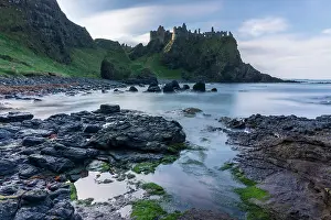 Clifftops Prints: Dunluce Castle perched dramatically on the clifftops of the Causeway Coast