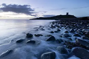 Northumberland Prints: Dunstanburgh Castle ruins and beach of basalt boulders near Embleton