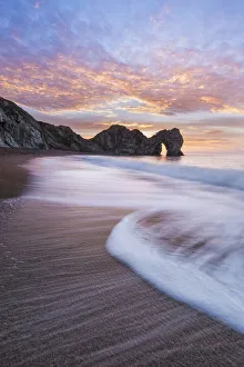 Durdle Door at sunrise, Jurassic Coast, Dorset, England