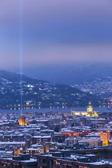 Meteorology Prints: Dusk on Como city after the snowfall with Christmas Light Tree event, lake Como, Lombardy