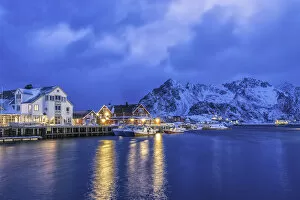 Images Dated 9th November 2015: Dusk in Henningsvaer with the first lights of the evening light up. Lofoten Islands