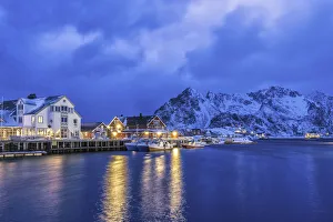 Dusk in Henningsvaer with the first lights of the evening light up. Lofoten Islands Dusk in Henningsvaer with the first lights of the evening light up. Lofoten Islands