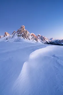 Ra Gusela Prints: Dusk lights on Ra Gusela mountain and snowy slopes, Giau Pass, Dolomites
