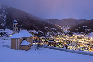 Bormio Prints: Dusk at Madonna di Ogas Church and Bormio town during winter, Bormio